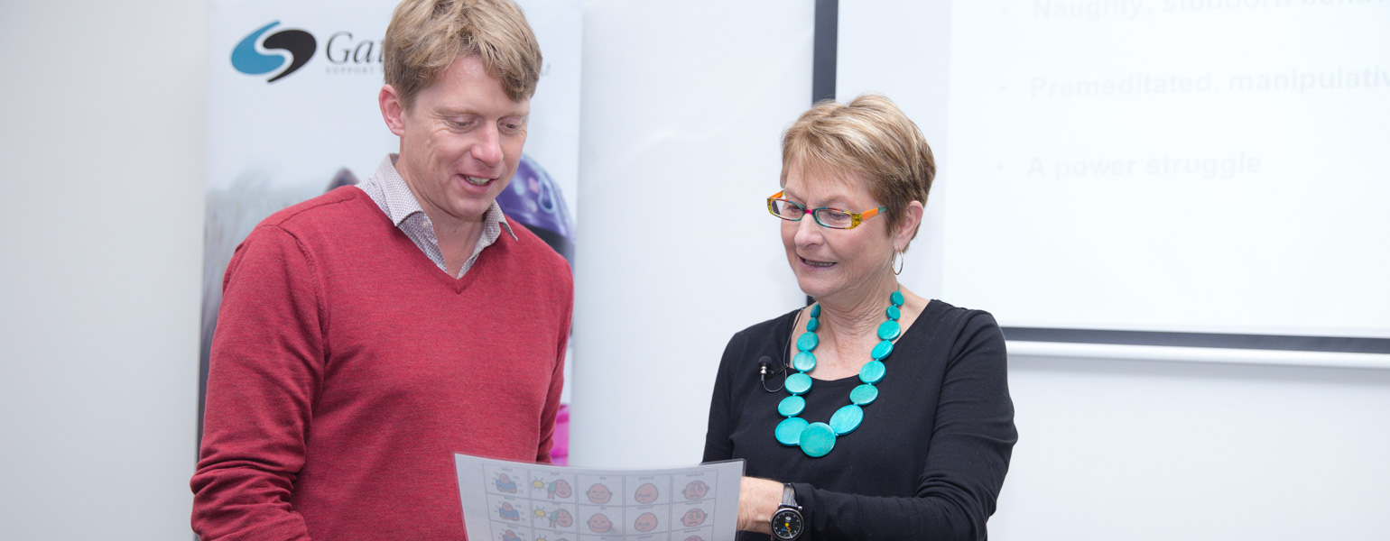 Gail shares some of the Gateways education resources with one of the parents who attended today's free autism seminar