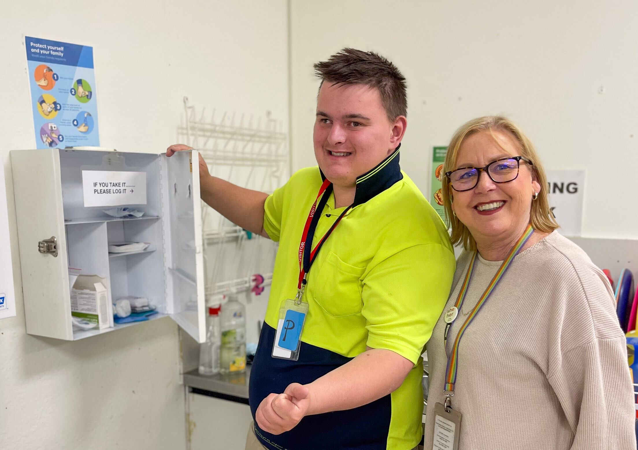 Man and woman standing in front of a first aid box in Gateways